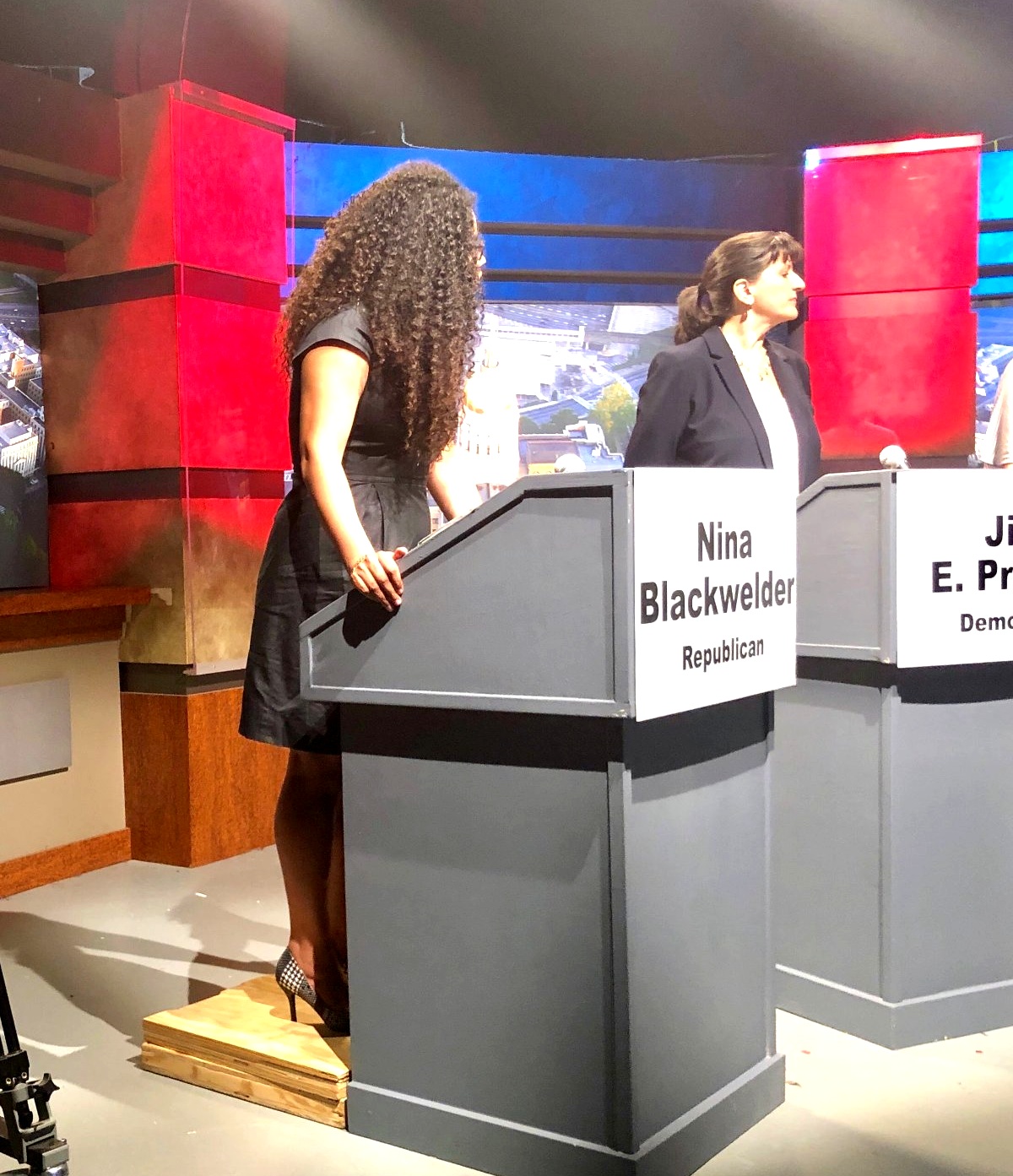 Nina Blackwelder at debate podium — Georgia House District 71, 2019
